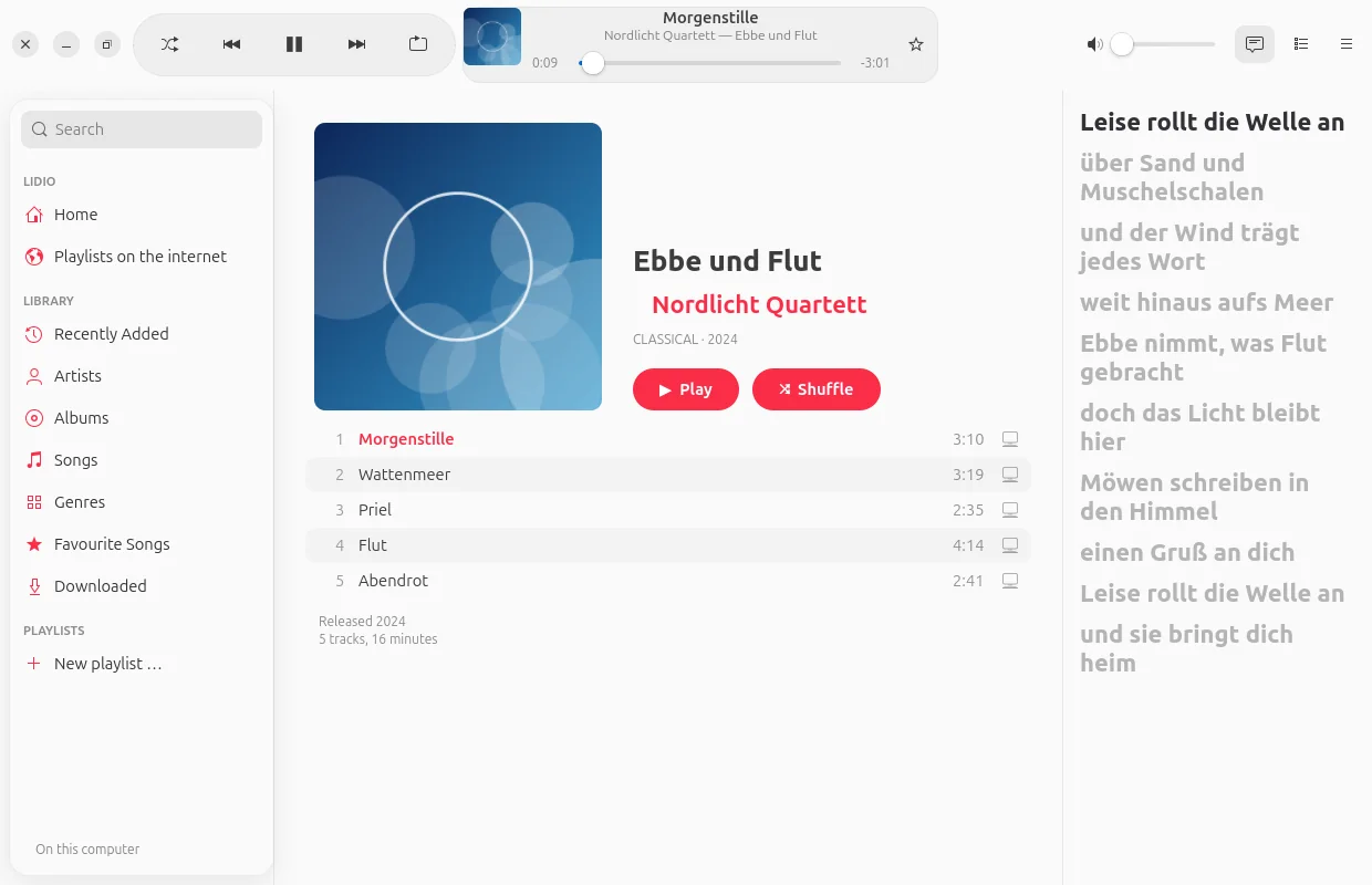 LiDio on Ubuntu: an album with its track list, the lyrics scrolling along on the right, playback at the top